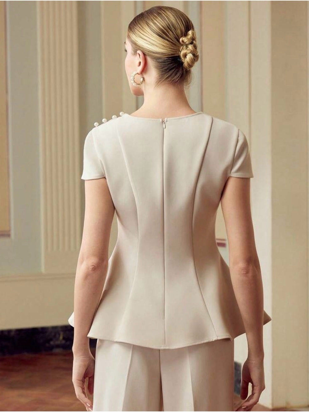 Elegant Cream Peplum Top with Button Shoulder Detail - Picture 3 of 3